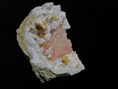 Dolomite and Calcite (variety manganese rich) on Quartz<br />State Route 37 road cuts, Harrodsburg, Clear Creek Township, Monroe County, Indiana, USA<br />quartz geode is 7 cm. the calcite is 5 cm<br /> (Author: Bob Harman)