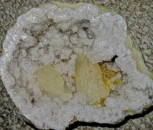 Calcite, Baryte and Quartz<br />State Route 37 road cuts, Harrodsburg, Clear Creek Township, Monroe County, Indiana, USA<br />Geode is 23 cm. The larger calcite is 7.5 cm; the smaller one is about 6.0 cm. the barite cluster is 3.7 cm<br /> (Author: Bob Harman)