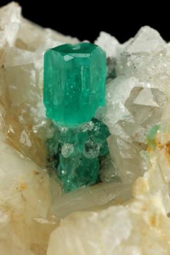 Beryl (variety emerald), Calcite, Quartz<br />Peñas Blancas Mine, Municipio San Pablo de Borbur, Western Emerald Belt, Boyacá Department, Colombia<br />78x51x44mm, main xl=12mm<br /> (Author: Fiebre Verde)