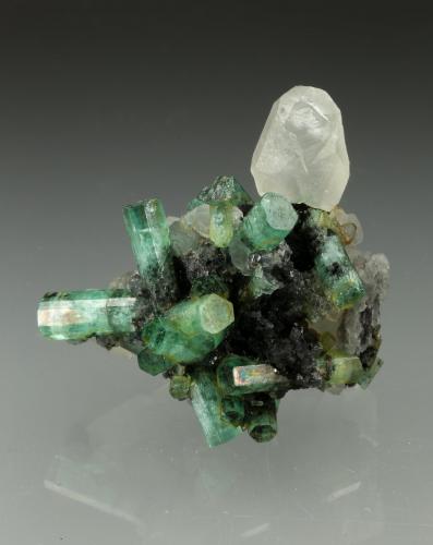 Beryl (variety emerald), Calcite<br />La Pita mining district, Polveros Mine, Municipio Maripí, Western Emerald Belt, Boyacá Department, Colombia<br />35x35mm<br /> (Author: Fiebre Verde)