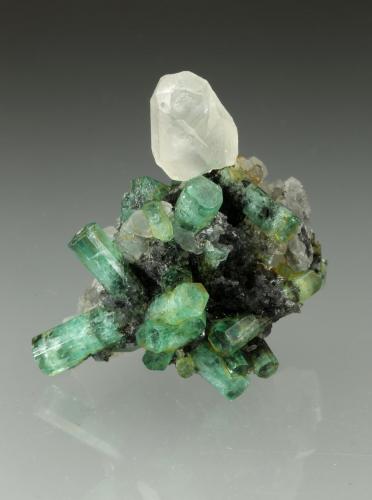 Beryl (variety emerald), Calcite<br />La Pita mining district, Polveros Mine, Municipio Maripí, Western Emerald Belt, Boyacá Department, Colombia<br />35x35mm<br /> (Author: Fiebre Verde)