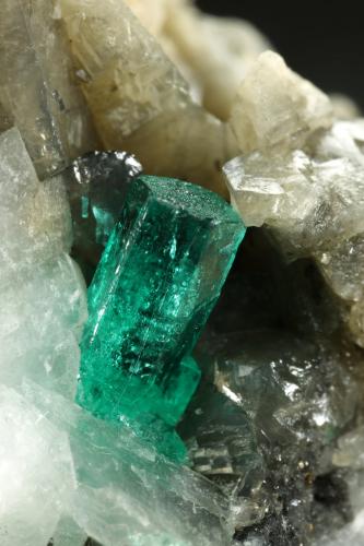 Beryl (variety emerald), Calcite, Pyrite<br />Muzo mining district, Western Emerald Belt, Boyacá Department, Colombia<br />27x37x35mm, main xl=7mm<br /> (Author: Fiebre Verde)