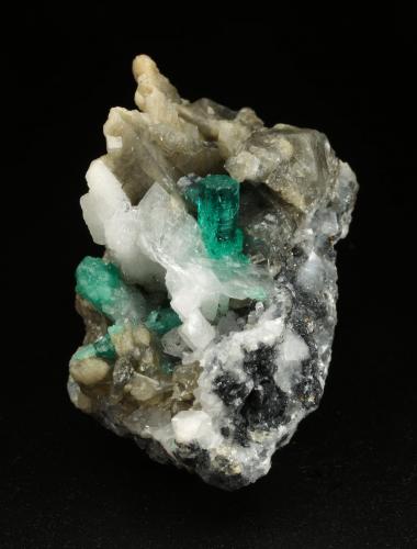 Beryl (variety emerald), Calcite, Pyrite<br />Muzo mining district, Western Emerald Belt, Boyacá Department, Colombia<br />27x37x35mm, main xl=7mm<br /> (Author: Fiebre Verde)