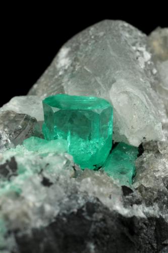 Beryl (variety emerald), Calcite, Dolomite<br />La Pita mining district, Cunas Mine, Municipio Maripí, Western Emerald Belt, Boyacá Department, Colombia<br />56x44x51mm, xls=7mm & 4mm<br /> (Author: Fiebre Verde)