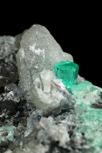 Beryl (variety emerald), Calcite, Dolomite<br />La Pita mining district, Cunas Mine, Municipio Maripí, Western Emerald Belt, Boyacá Department, Colombia<br />56x44x51mm, xls=7mm & 4mm<br /> (Author: Fiebre Verde)