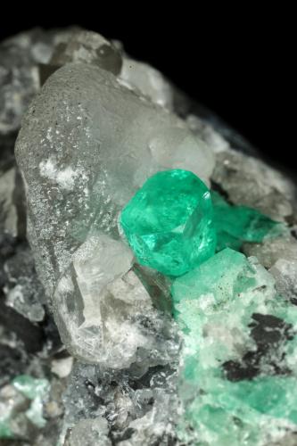 Beryl (variety emerald), Calcite, Dolomite<br />La Pita mining district, Cunas Mine, Municipio Maripí, Western Emerald Belt, Boyacá Department, Colombia<br />56x44x51mm, xls=7mm & 4mm<br /> (Author: Fiebre Verde)