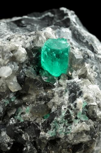 Beryl (variety emerald), Calcite, Dolomite<br />La Pita mining district, Cunas Mine, Municipio Maripí, Western Emerald Belt, Boyacá Department, Colombia<br />56x44x51mm, xls=7mm & 4mm<br /> (Author: Fiebre Verde)