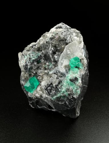 Beryl (variety emerald), Calcite, Dolomite<br />La Pita mining district, Cunas Mine, Municipio Maripí, Western Emerald Belt, Boyacá Department, Colombia<br />56x44x51mm, xls=7mm & 4mm<br /> (Author: Fiebre Verde)