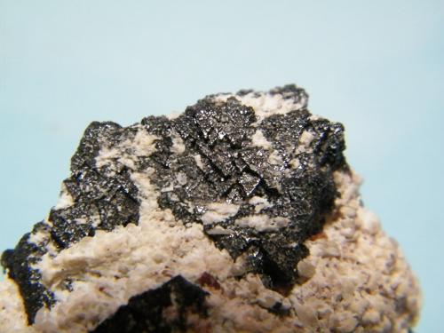 Hausmannite, Andradite and Calcite<br />Kalahari manganese field (KMF), Northern Cape Province, South Africa<br />44mm x 37mm x 25mm<br /> (Author: Heimo Hellwig)
