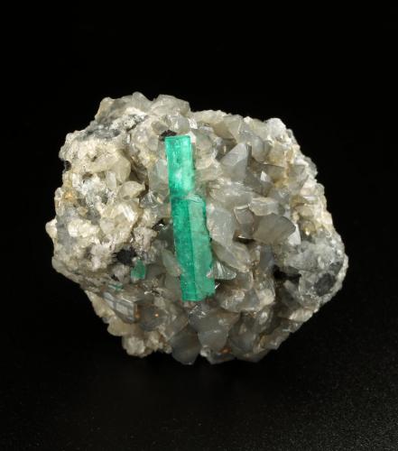 Beryl (variety emerald), Calcite, Dolomite<br />La Pita mining district, Municipio Maripí, Western Emerald Belt, Boyacá Department, Colombia<br />40x43x29mm, xl=22mm<br /> (Author: Fiebre Verde)