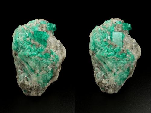 Beryl (variety emerald), Calcite, Muscovite<br />La Pita mining district, Cunas Mine, Municipio Maripí, Western Emerald Belt, Boyacá Department, Colombia<br />40x63x47mm, largest xl=14x11mm<br /> (Author: Fiebre Verde)