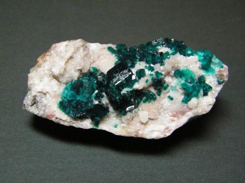 Dioptase on Calcite<br />Tsumeb Mine, Tsumeb, Otjikoto Region, Namibia<br />60mm x 29mm x 25mm<br /> (Author: Heimo Hellwig)