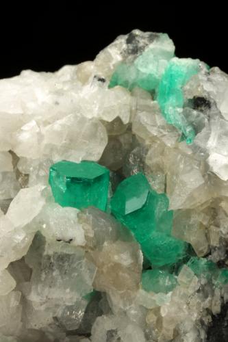 Beryl (variety emerald), Calcite, Dolomite, Pyrite<br />La Pita mining district, Polveros Mine, Municipio Maripí, Western Emerald Belt, Boyacá Department, Colombia<br />52x56x46mm, xls=10 & 5mm<br /> (Author: Fiebre Verde)