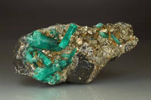 Beryl (variety emerald), Albite (variety cleavelandite), Pyrite<br />Chivor mining district, El Oriente Mine, Municipio Chivor, Eastern Emerald Belt, Boyacá Department, Colombia<br />110x54x20mm, largest xl=30mm<br /> (Author: Fiebre Verde)