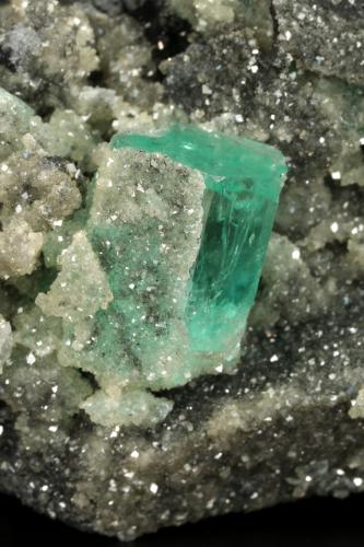 Beryl (variety emerald), Calcite, Pyrite<br />Muzo mining district, Western Emerald Belt, Boyacá Department, Colombia<br />90x45x58mm, main xl=16x11mm<br /> (Author: Fiebre Verde)