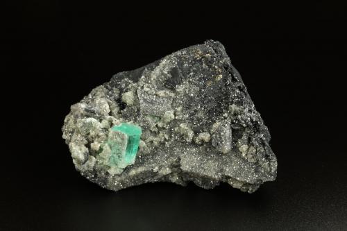 Beryl (variety emerald), Calcite, Pyrite<br />Muzo mining district, Western Emerald Belt, Boyacá Department, Colombia<br />90x45x58mm, main xl=16x11mm<br /> (Author: Fiebre Verde)