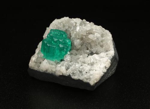 Beryl (variety emerald), Calcite, Dolomite<br />La Pita mining district, Municipio Maripí, Western Emerald Belt, Boyacá Department, Colombia<br />28x36x19mm, aggregate=6x9mm<br /> (Author: Fiebre Verde)