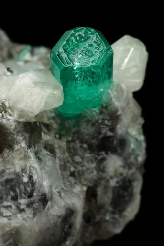 Beryl (variety emerald), Calcite<br />La Pita mining district, Cunas Mine, Municipio Maripí, Western Emerald Belt, Boyacá Department, Colombia<br />37x41x24mm, xl=9mm<br /> (Author: Fiebre Verde)