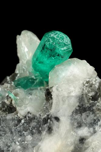 Beryl (variety emerald), Calcite<br />La Pita mining district, Cunas Mine, Municipio Maripí, Western Emerald Belt, Boyacá Department, Colombia<br />37x41x24mm, xl=9mm<br /> (Author: Fiebre Verde)