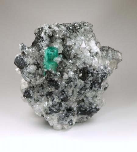 Beryl (variety emerald), Calcite, Pyrite<br />La Pita mining district, Polveros Mine, Municipio Maripí, Western Emerald Belt, Boyacá Department, Colombia<br />77x86x68mm, xl=19mm<br /> (Author: Fiebre Verde)