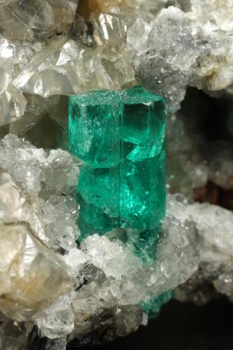 Beryl (variety emerald), Calcite, Dolomite, Pyrite<br />La Pita mining district, Municipio Maripí, Western Emerald Belt, Boyacá Department, Colombia<br />67x53x27mm, xl=11mm<br /> (Author: Fiebre Verde)