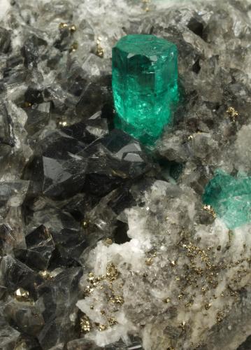 Beryl (variety emerald), Calcite, Dolomite, Pyrite<br />Chivor mining district, El Acuario Mine, Municipio Chivor, Eastern Emerald Belt, Boyacá Department, Colombia<br />84x43x54mm, xl=7mm<br /> (Author: Fiebre Verde)