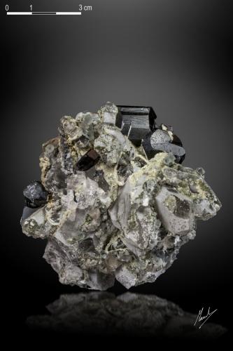 Cassiterite and Scheelite on Quartz<br />Taoxikeng Mine, Chongyi, Ganzhou Prefecture, Jiangxi Province, China<br />70 X 62 mm<br /> (Author: Manuel Mesa)