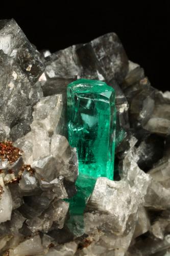Beryl (variety emerald), Calcite, Pyrite<br />Coscuez (distrito minero), Municipio San Pablo de Borbur, Cinturón Esmeraldífero Occidental, Departamento Boyacá, Colombia<br />67x47x55mm, xl=19mm<br /> (Author: Fiebre Verde)