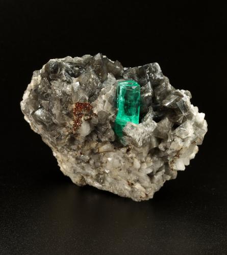 Beryl (variety emerald), Calcite, Pyrite<br />Coscuez (distrito minero), Municipio San Pablo de Borbur, Cinturón Esmeraldífero Occidental, Departamento Boyacá, Colombia<br />67x47x55mm, xl=19mm<br /> (Author: Fiebre Verde)