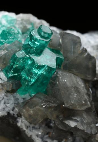 Beryl (variety emerald), Calcite, Dolomite<br />La Pita mining district, Cunas Mine, Municipio Maripí, Western Emerald Belt, Boyacá Department, Colombia<br />33x20x23mm, main aggregate=10x9mm<br /> (Author: Fiebre Verde)