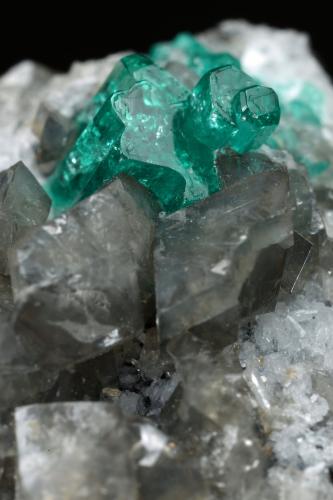 Beryl (variety emerald), Calcite, Dolomite<br />La Pita mining district, Cunas Mine, Municipio Maripí, Western Emerald Belt, Boyacá Department, Colombia<br />33x20x23mm, main aggregate=10x9mm<br /> (Author: Fiebre Verde)