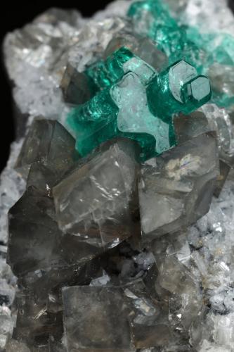 Beryl (variety emerald), Calcite, Dolomite<br />La Pita mining district, Cunas Mine, Municipio Maripí, Western Emerald Belt, Boyacá Department, Colombia<br />33x20x23mm, main aggregate=10x9mm<br /> (Author: Fiebre Verde)