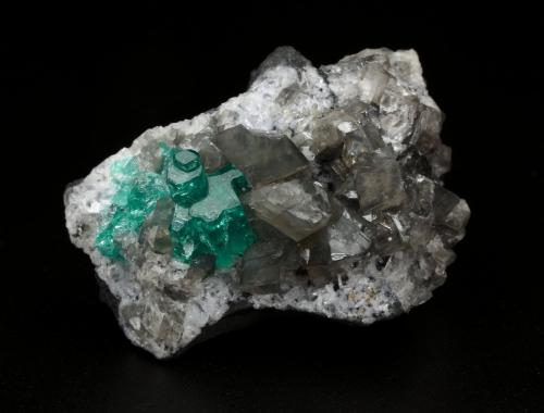 Beryl (variety emerald), Calcite, Dolomite<br />La Pita mining district, Cunas Mine, Municipio Maripí, Western Emerald Belt, Boyacá Department, Colombia<br />33x20x23mm, main aggregate=10x9mm<br /> (Author: Fiebre Verde)