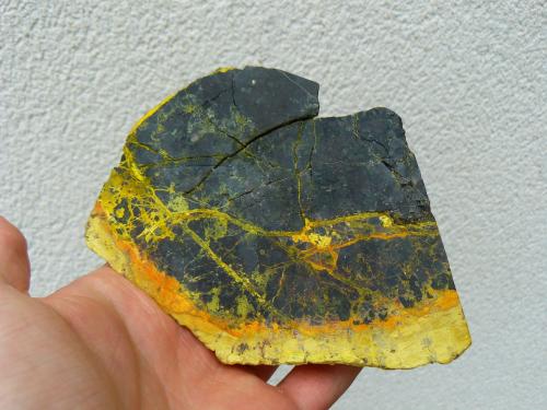 Uraninite (variety "pitchblende") with "gummites" and Curite (?)<br />Margnac II Mine, Compreignac, Bellac, Haute-Vienne Department, Nouvelle-Aquitaine, France<br />10 x 9 cm<br /> (Author: Benj)