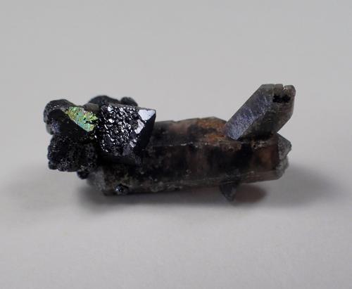 Brookite, Quartz (variety smoky)<br />Rutherford Deposit (Moses Hill), Magnet Cove, Hot Spring County, Arkansas, USA<br />22.5 mm x 11.3 mm x 9.9 mm<br /> (Author: Don Lum)