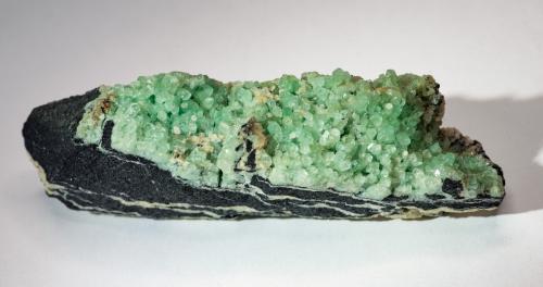 Beryl (variety emerald), Albite, Dolomite<br />Coscuez mining district, Calceteros Mine, Municipio San Pablo de Borbur, Western Emerald Belt, Boyacá Department, Colombia<br />9.9cm L x 2.4cm W x 3.5cm H<br /> (Author: Bergur_E_Sigurdarson)