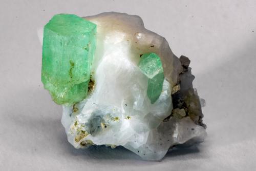 Beryl (variety emerald), Dolomite, Calcite<br />Muzo mining district, Western Emerald Belt, Boyacá Department, Colombia<br />W 3.4cm x H 2.5cm x D 2.1cm<br /> (Author: Bergur_E_Sigurdarson)