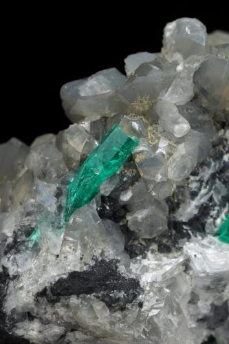 Beryl (variety emerald), Calcite, Dolomite<br />La Pita mining district, Cunas Mine, Municipio Maripí, Western Emerald Belt, Boyacá Department, Colombia<br />47x45x47mm, xl=18mm - 2 xls in the back: 11mm & 7mm<br /> (Author: Fiebre Verde)