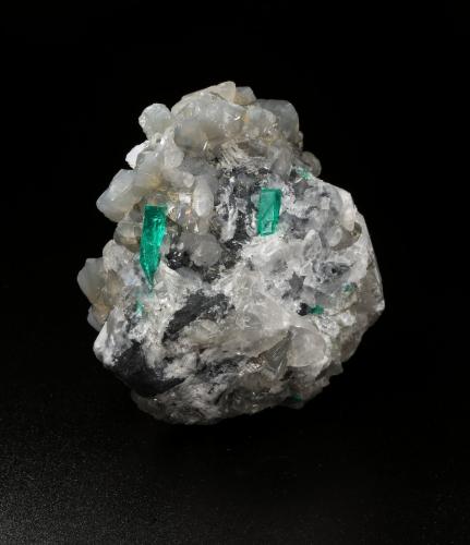 Beryl (variety emerald), Calcite, Dolomite<br />La Pita mining district, Cunas Mine, Municipio Maripí, Western Emerald Belt, Boyacá Department, Colombia<br />47x45x47mm, xl=18mm - 2 xls in the back: 11mm & 7mm<br /> (Author: Fiebre Verde)