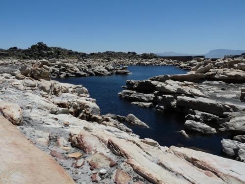 The same reservoir, with a small clear stream running into it. (Author: Pierre Joubert)