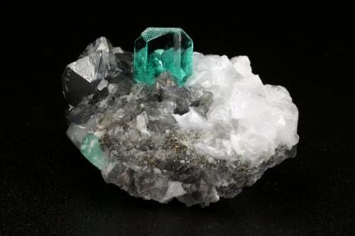 Beryl (variety emerald), Calcite, Pyrite, Quartz<br />Muzo mining district, Western Emerald Belt, Boyacá Department, Colombia<br />32x21x20mm, xls=7mm (main) & 17mm<br /> (Author: Fiebre Verde)