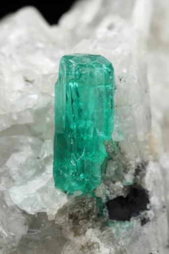 Beryl (variety emerald), Calcite<br />Coscuez mining district, Municipio San Pablo de Borbur, Western Emerald Belt, Boyacá Department, Colombia<br />18x30x34mm, xl=9mm<br /> (Author: Fiebre Verde)