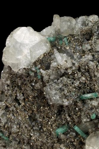 Beryl (variety emerald), Calcite, Pyrite<br />Chivor (distrito minero), Municipio Chivor, Cinturón Esmeraldífero Oriental, Departamento Boyacá, Colombia<br />89x138x35mm, 15+ xls up to 10mm<br /> (Author: Fiebre Verde)