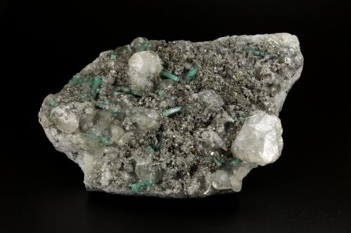 Beryl (variety emerald), Calcite, Pyrite<br />Chivor (distrito minero), Municipio Chivor, Cinturón Esmeraldífero Oriental, Departamento Boyacá, Colombia<br />89x138x35mm, 15+ xls up to 10mm<br /> (Author: Fiebre Verde)