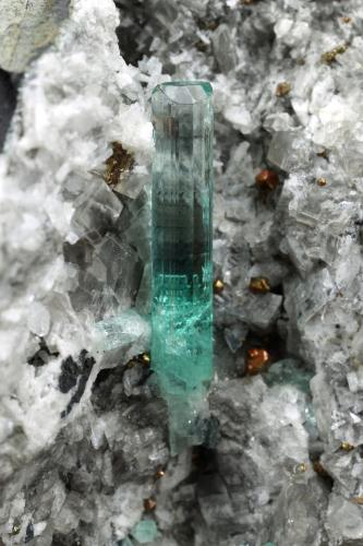 Beryl (variety emerald), Calcite, Pyrite<br />Chivor mining district, Palo Arañado Mine, Municipio Chivor, Eastern Emerald Belt, Boyacá Department, Colombia<br />51x49x46mm, main xl=20mm<br /> (Author: Fiebre Verde)