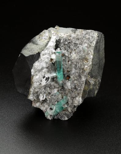 Beryl (variety emerald), Calcite, Pyrite<br />Chivor mining district, Palo Arañado Mine, Municipio Chivor, Eastern Emerald Belt, Boyacá Department, Colombia<br />51x49x46mm, main xl=20mm<br /> (Author: Fiebre Verde)