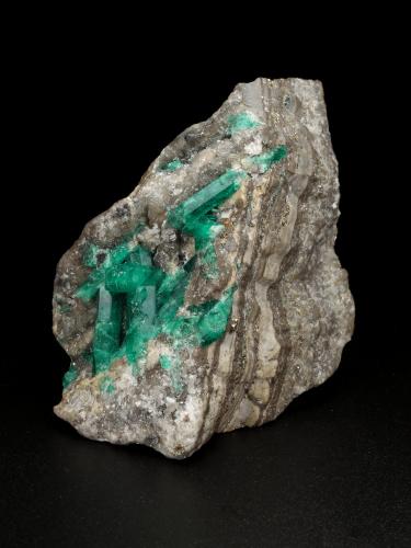 Beryl (variety emerald), Calcite, Pyrite<br />La Pita mining district, Municipio Maripí, Western Emerald Belt, Boyacá Department, Colombia<br />59x40x41mm, largest xl=20mm<br /> (Author: Fiebre Verde)