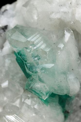 Beryl (variety emerald), Calcite<br />Muzo mining district, Western Emerald Belt, Boyacá Department, Colombia<br />45x47x32mm, xl=15mm<br /> (Author: Fiebre Verde)