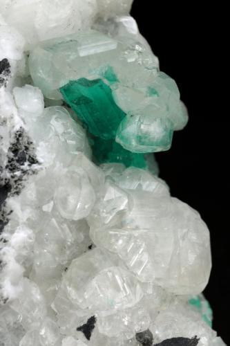 Beryl (variety emerald), Calcite<br />Muzo mining district, Western Emerald Belt, Boyacá Department, Colombia<br />45x47x32mm, xl=15mm<br /> (Author: Fiebre Verde)