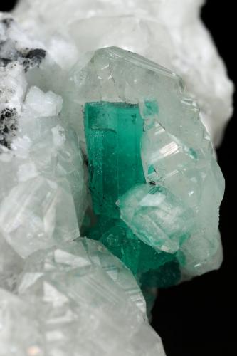 Beryl (variety emerald), Calcite<br />Muzo mining district, Western Emerald Belt, Boyacá Department, Colombia<br />45x47x32mm, xl=15mm<br /> (Author: Fiebre Verde)